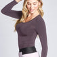 Side view of a woman wearing a fuller bust long sleeve scoop neck pullover in Quartz designed by Miriam Baker.