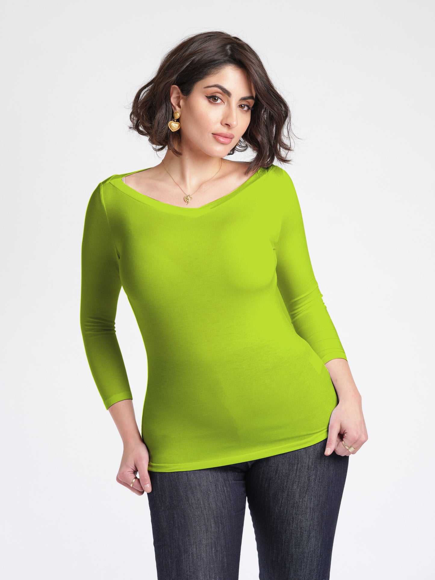 Woman wearing a 3/4 length sleeve fuller bust bamboo pullover with stylized boatneck in Lime Punch by Miriam Baker.